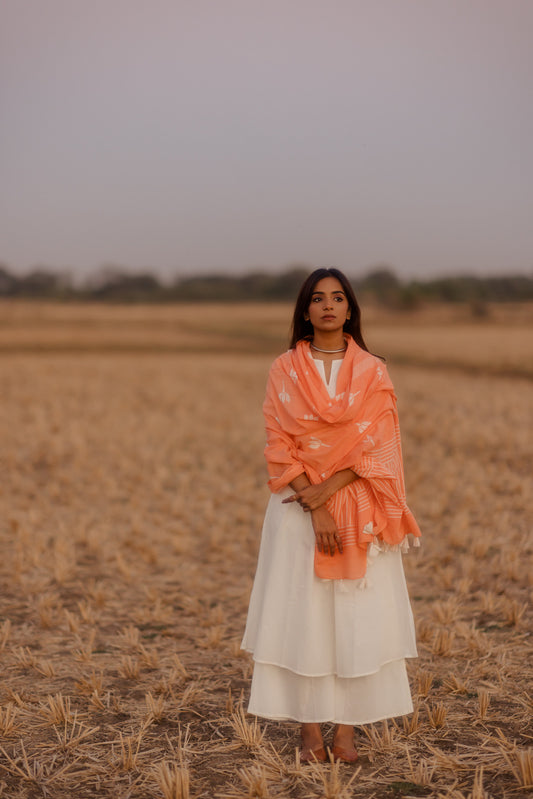 Crisp white kurta set with melon printed dupatta