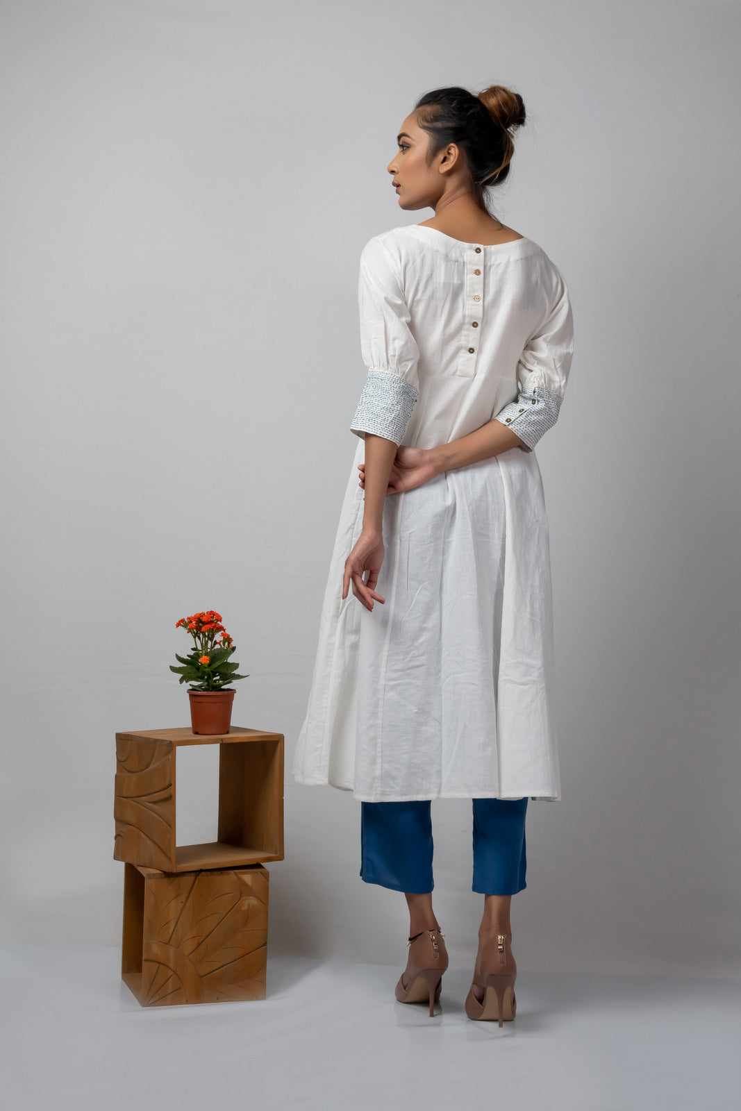 white flared dress with blue kantha details