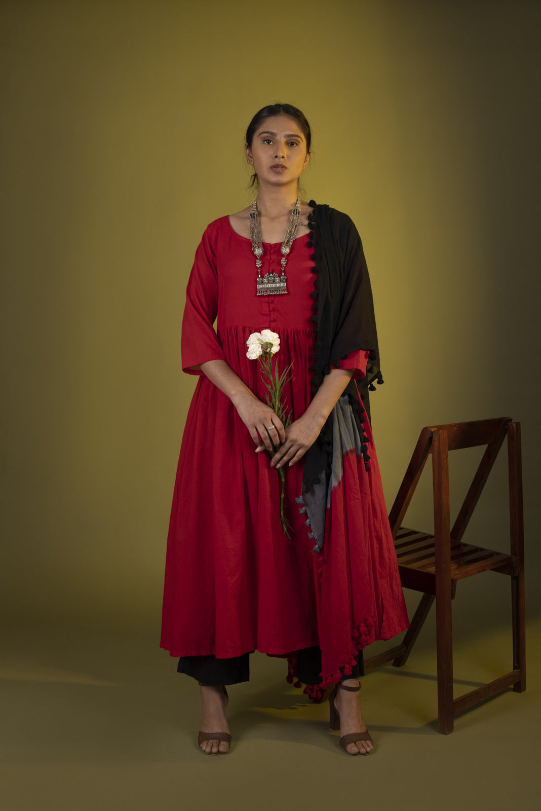 Red gathered dress with black pants and dupatta